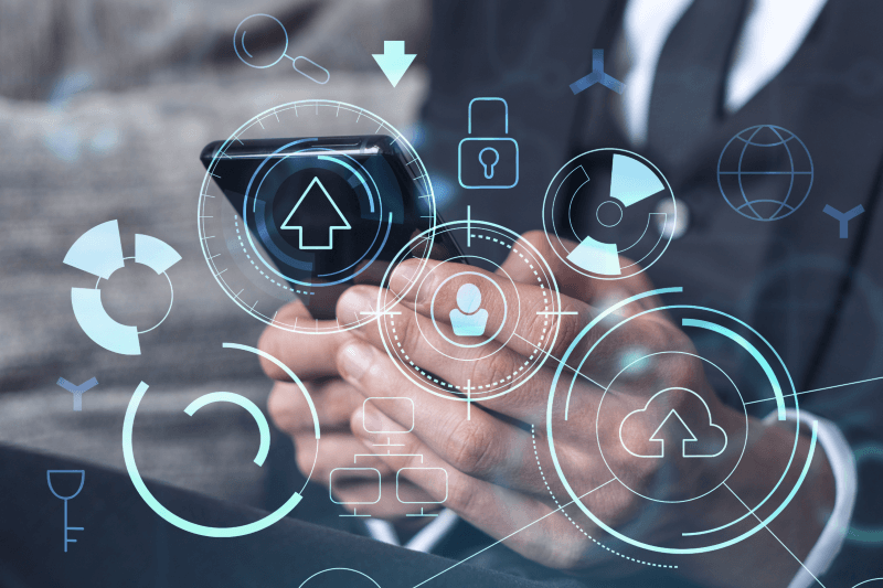 programmer holds smartphone and tests an application