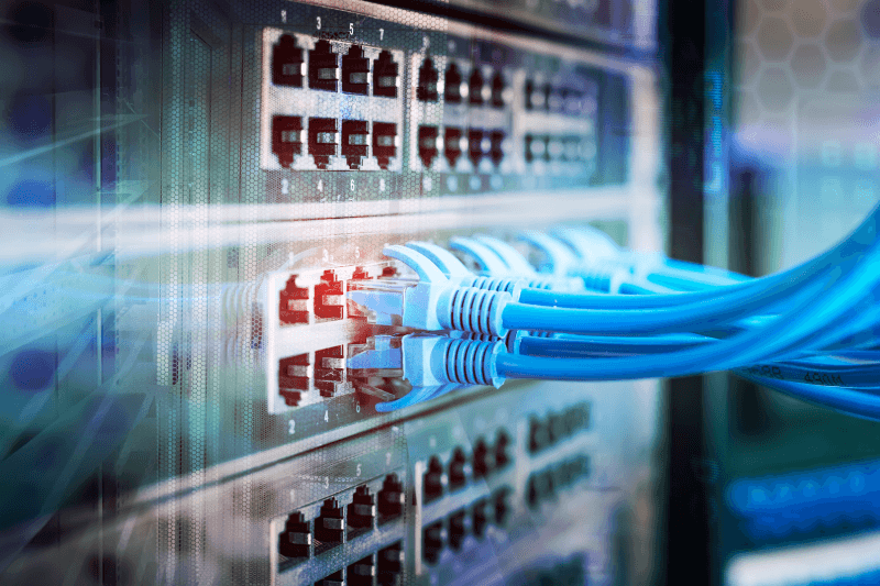 network panel with a switch and cable in data center